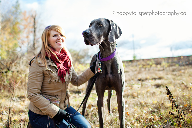 Woman and dog in Ontario field.