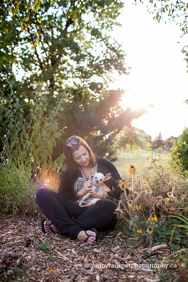 Woman and her dog at Oakville park for outdoor pet photography session.