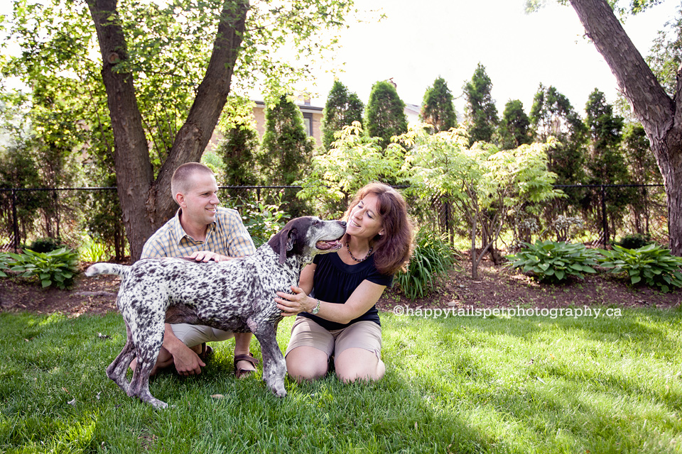 The bond between pets and people in backyard dog photography session in Oakville.