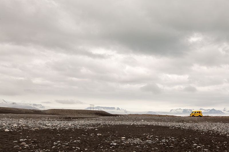 Yellow camper van in Jökulsárlón, Iceland.