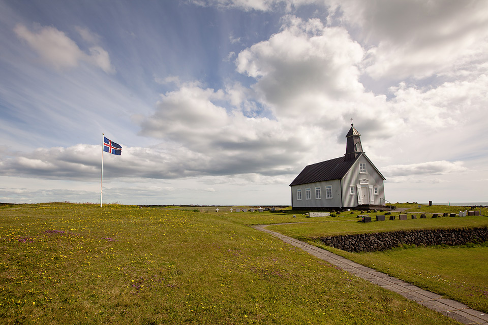 Cute church and patriotic flag along Iceland's south coast.