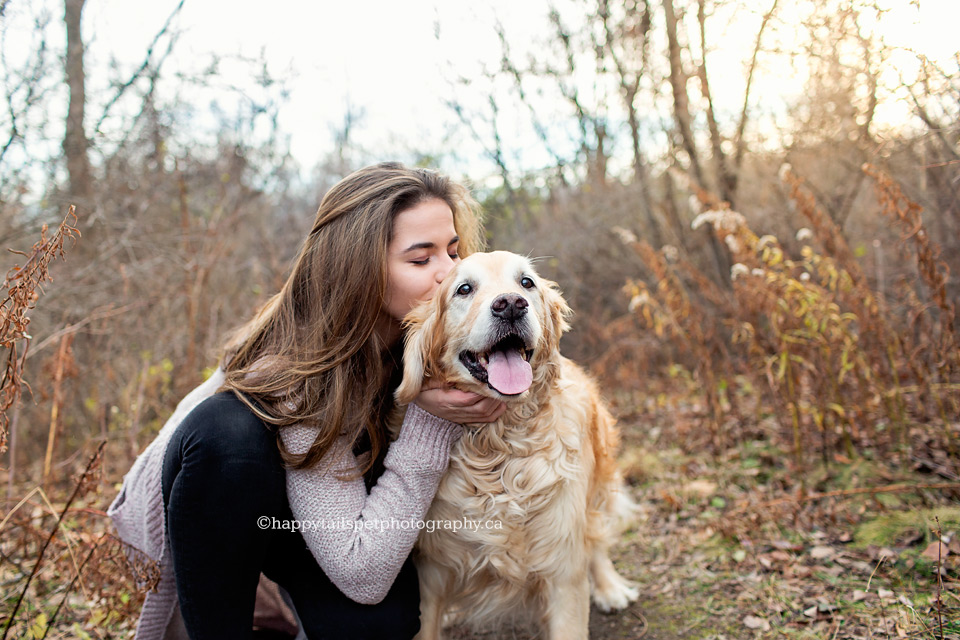 Pretty girl kisses old dog at Kerncliff Park in Burlington.